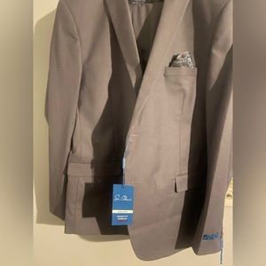 Three piece suit brand new . Still needs to be hemmed